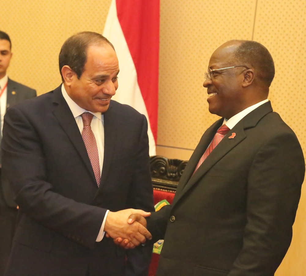 President Dr. John Pombe Magufuli and Egyptian President Abdel Fattah El-Sis share a light moment  after their  addresses