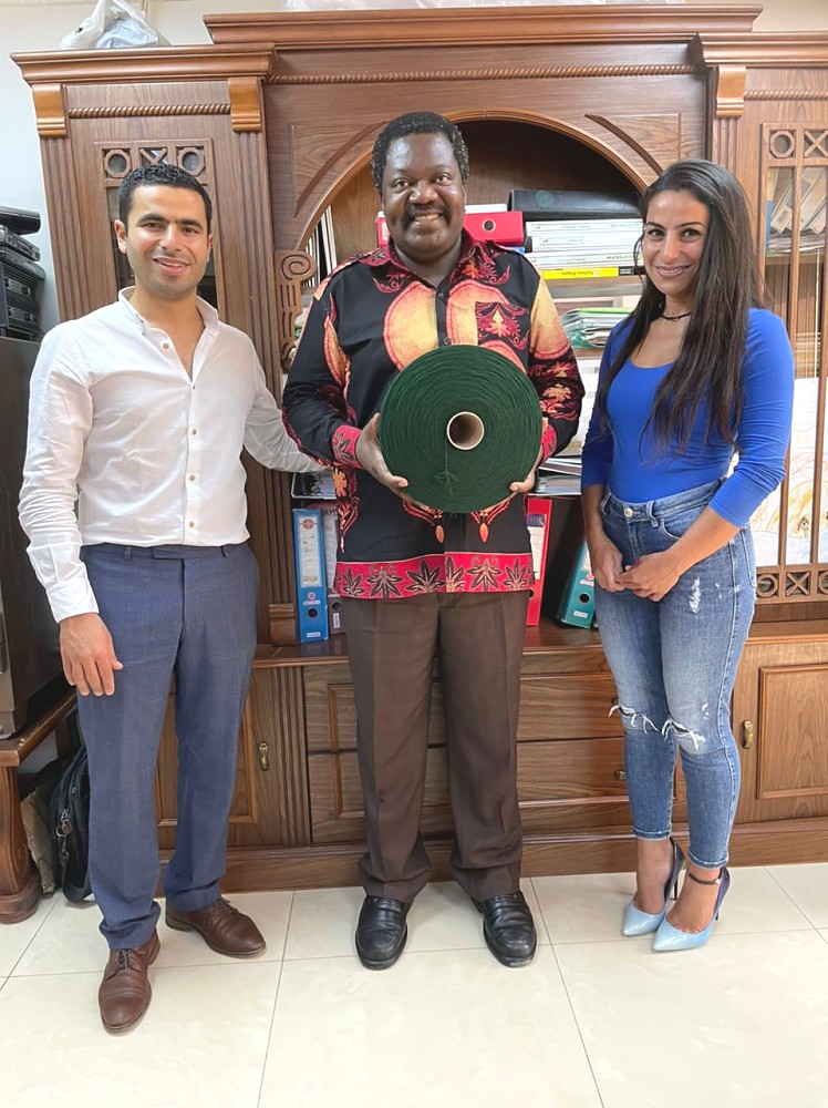 Mhe. Balozi katika Picha ya pamoja na wamiliki wa kiwanda cha Alsaratex